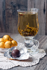 Chocolate balls and tea in glass