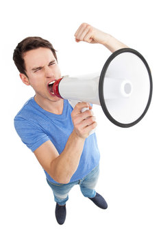 Young man shouting through megaphone