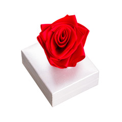 Gift box with red rose isolated over white