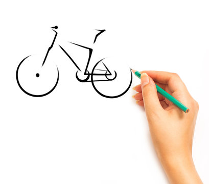 Woman's Hand draws a bicycle on white