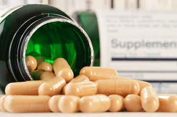 Composition with dietary supplement capsules. Drug pills