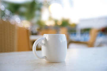 espresso coffee in  white cup in a cafe, super shallow dof