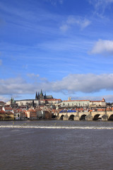 View on the winter Prague gothic Castle with the Charles Bridge
