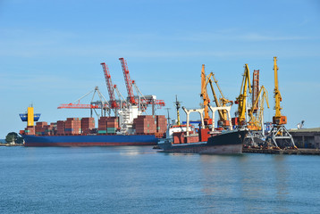 Fototapeta premium Bulk cargo ship under port crane bridge, Odessa, Ukraine