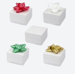 Set of white cardboxes with a bow on top.