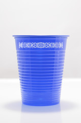 blue color plastic cup with tribal draw
