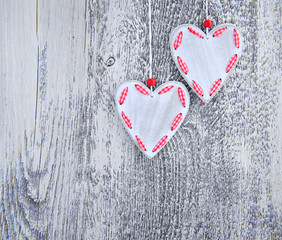 Valentines Day background. Two hearts on wooden background