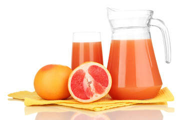 Full glass and jug of grapefruit juice and grapefruits isolated