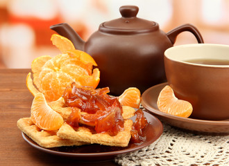 light breakfast with tea and homemade jam, on wooden table