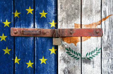 EU and Cyprus flag on the background of old locked doors
