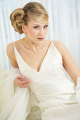 Fototapeta na wymiar Close Up Portrait of a Beautiful Bride in White Dress