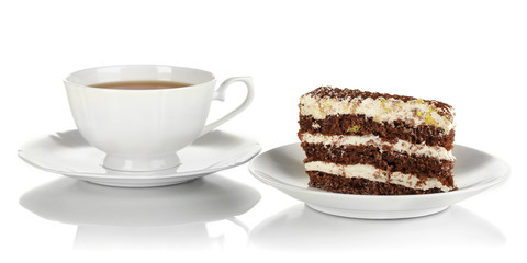 A cup of tea and delicious cake isolated on white