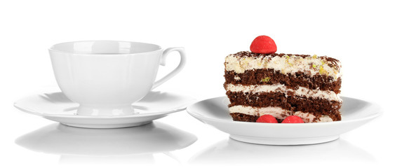 A cup of tea and delicious cake isolated on white