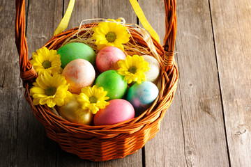 Colored easter eggs in basket