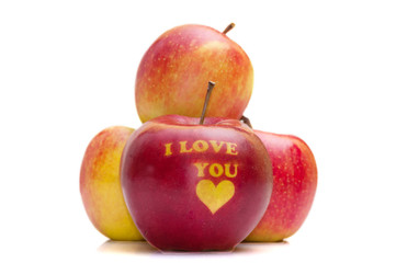 ripe red apple with the words 