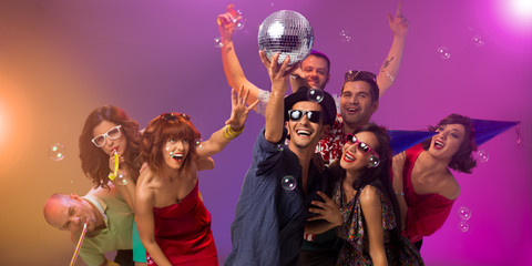 young people partying with disco ball
