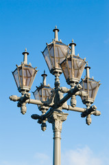 Fototapeta na wymiar Lantern of street illumination on a background of the sky