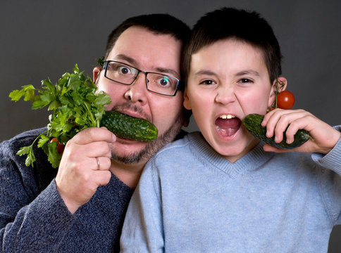 Dad and son with vegetables