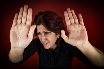 Frightened woman defending herself