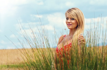 Young happy woman in a summer day