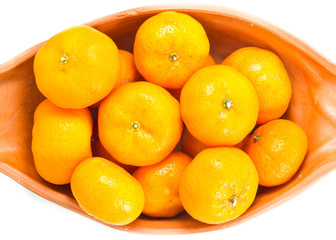 small orange in bowl isolated on white background