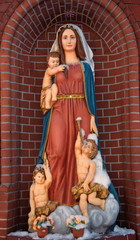 Sculpture of Our Lady in a niche of the Catholic church