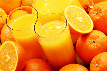 Composition with two glasses of orange juice and fruits