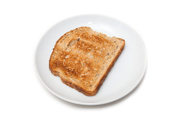 Plate of wholemeal toast isolated on a white studio background.