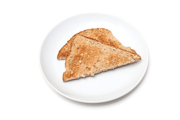 Plate of wholemeal toast isolated on a white studio background.