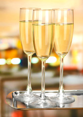 Corporate party: sparkling champagne glasses on tray
