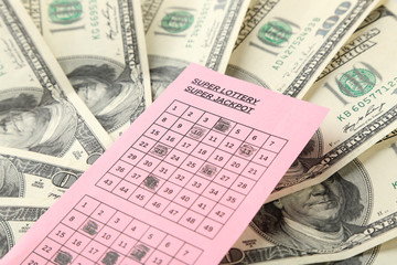 Lottery ticket and money, close up
