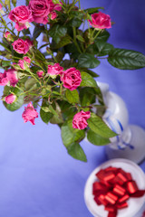 Bouquet of pink roses with round gift boxes
