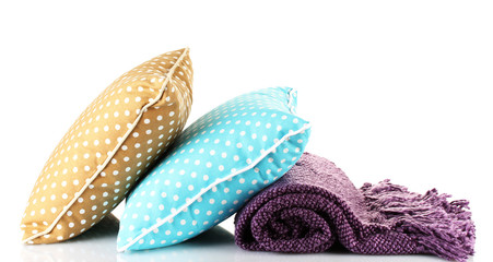 Warm plaid and color pillow, isolated on white