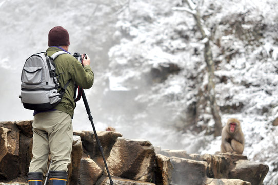 A man taking photos in Snow Monkey, Japan