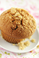 Brown sugar muffin in a white plate.
