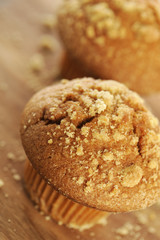Fototapeta na wymiar Brown sugar muffin on a wooden background.