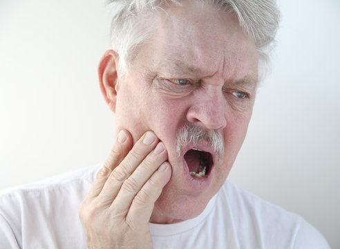 Man With Pain In Cheek