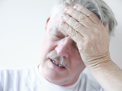 man with dizziness and head pain
