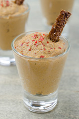 chicken liver pate in portion glasses with toast closeup