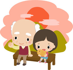 夕方にベンチに座るおじいさんと小さい女の子