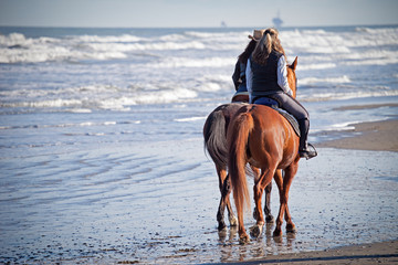Riding Horses on the Beach
