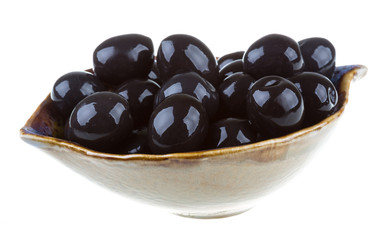 Olives black watered with olive oil in a bowl isolated on a whit