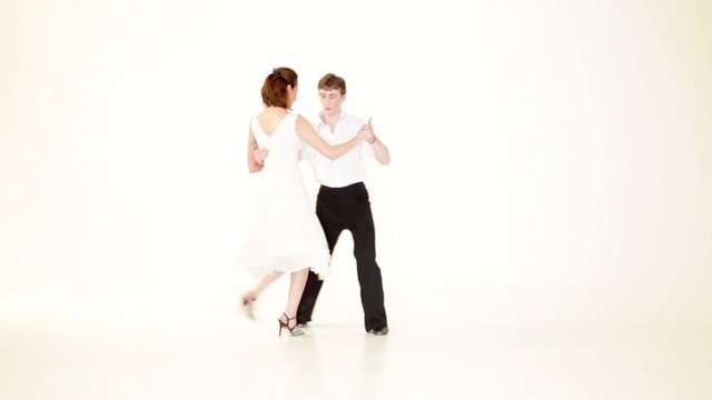 couple showing dance moves on white background
