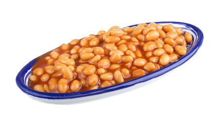 Marinated haricot beans in tomato sauce with shallots on a plate