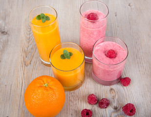Fresh orange and raspberry smoothie drinks