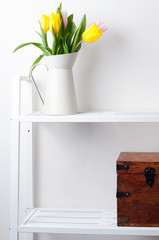 home interior decoration: a bouquet of tulips and a box
