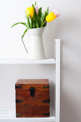 home interior decoration: a bouquet of tulips and a box