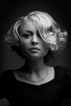 glamour portrait of beautiful curly blonde girl