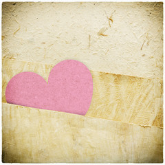 heart recycled paper stick on paper background Vignette photo an