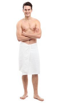 Young man wearing towel